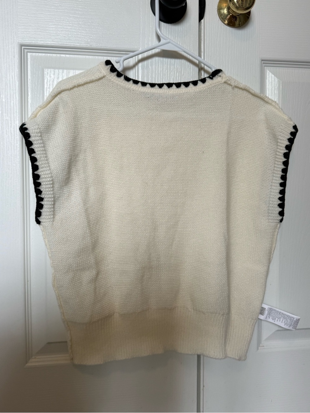 Cream Knit Sleeveless Sweater with Black Trim